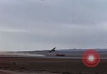 Image of crash of F-100 Super Sabre caught in "Sabre Dance" California USA, 1956, second 5 stock footage video 65675045359