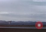 Image of crash of F-100 Super Sabre caught in "Sabre Dance" California USA, 1956, second 10 stock footage video 65675045359
