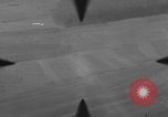 Image of P-47 of U.S. 404th squadron strafing European Theater, 1945, second 29 stock footage video 65675045658