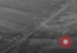 Image of P-47 piloted by Lt Johnson strafes roads European Theater, 1945, second 33 stock footage video 65675045659