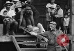 Image Les anciens prisonniers de guerre d'être évacués par les sauveteurs du camp de prisonniers japonais Cabanatuan Philippines, 1945, de la seconde 8 séquences d'archives historiques vidéo 65675045818