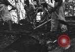 Image of Palawan Massacre prisoners bodies recovered Palawan Philippines, 1945, second 52 stock footage video 65675045828