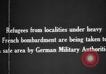 Image German military aider des réfugiés en provenance de zones de lourds bombardements Français Front Ouest, 1915, de la seconde 9 séquences d'archives historiques vidéo 65675045933