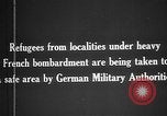 Image German military aider des réfugiés en provenance de zones de lourds bombardements Français Front Ouest, 1915, de la seconde 10 séquences d'archives historiques vidéo 65675045933