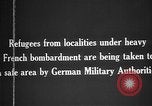 Image German military aider des réfugiés en provenance de zones de lourds bombardements Français Front Ouest, 1915, de la seconde 12 séquences d'archives historiques vidéo 65675045933