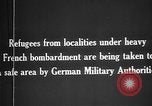 Image German military aider des réfugiés en provenance de zones de lourds bombardements Français Front Ouest, 1915, de la seconde 13 séquences d'archives historiques vidéo 65675045933