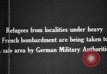 Image German military aider des réfugiés en provenance de zones de lourds bombardements Français Front Ouest, 1915, de la seconde 14 séquences d'archives historiques vidéo 65675045933