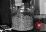 Image of Capsules in glass container United States USA, 1940, second 42 stock footage video 65675046219