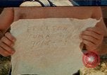 Image of people at beach Pacific Theater, 1945, second 1 stock footage video 65675046444