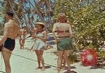 Image of people at beach Pacific Theater, 1945, second 4 stock footage video 65675046444