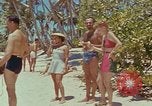 Image of people at beach Pacific Theater, 1945, second 5 stock footage video 65675046444