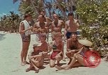 Image of people at beach Pacific Theater, 1945, second 9 stock footage video 65675046444