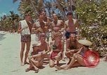 Image of people at beach Pacific Theater, 1945, second 10 stock footage video 65675046444