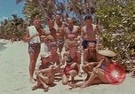 Image of people at beach Pacific Theater, 1945, second 11 stock footage video 65675046444