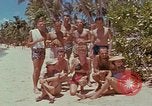 Image of people at beach Pacific Theater, 1945, second 12 stock footage video 65675046444