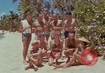 Image of people at beach Pacific Theater, 1945, second 13 stock footage video 65675046444
