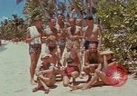 Image of people at beach Pacific Theater, 1945, second 14 stock footage video 65675046444