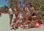 Image of people at beach Pacific Theater, 1945, second 16 stock footage video 65675046444