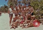 Image of people at beach Pacific Theater, 1945, second 17 stock footage video 65675046444