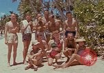 Image of people at beach Pacific Theater, 1945, second 18 stock footage video 65675046444