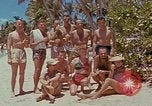 Image of people at beach Pacific Theater, 1945, second 19 stock footage video 65675046444