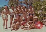 Image of people at beach Pacific Theater, 1945, second 20 stock footage video 65675046444