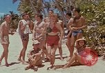 Image of people at beach Pacific Theater, 1945, second 24 stock footage video 65675046444