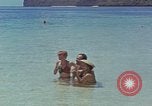 Image of people at beach Pacific Theater, 1945, second 25 stock footage video 65675046444