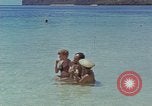 Image of people at beach Pacific Theater, 1945, second 26 stock footage video 65675046444
