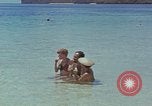 Image of people at beach Pacific Theater, 1945, second 27 stock footage video 65675046444
