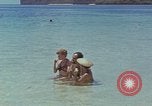 Image of people at beach Pacific Theater, 1945, second 28 stock footage video 65675046444