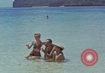 Image of people at beach Pacific Theater, 1945, second 29 stock footage video 65675046444