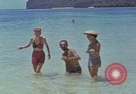 Image of people at beach Pacific Theater, 1945, second 31 stock footage video 65675046444