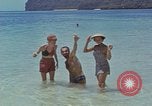 Image of people at beach Pacific Theater, 1945, second 32 stock footage video 65675046444