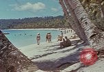 Image of people at beach Pacific Theater, 1945, second 42 stock footage video 65675046444