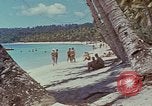 Image of people at beach Pacific Theater, 1945, second 44 stock footage video 65675046444