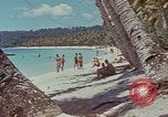 Image of people at beach Pacific Theater, 1945, second 46 stock footage video 65675046444