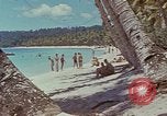 Image of people at beach Pacific Theater, 1945, second 47 stock footage video 65675046444