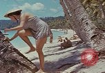 Image of people at beach Pacific Theater, 1945, second 54 stock footage video 65675046444