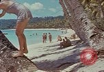 Image of people at beach Pacific Theater, 1945, second 59 stock footage video 65675046444