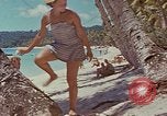Image of people at beach Pacific Theater, 1945, second 60 stock footage video 65675046444