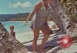 Image of people at beach Pacific Theater, 1945, second 61 stock footage video 65675046444