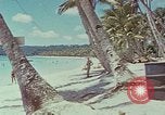 Image of people at beach Pacific Theater, 1945, second 62 stock footage video 65675046444