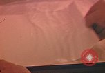 Image of Developing photographs in a dark room Pacific Theater, 1945, second 4 stock footage video 65675046450