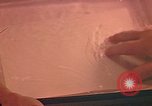 Image of Developing photographs in a dark room Pacific Theater, 1945, second 5 stock footage video 65675046450