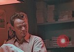 Image of Developing photographs in a dark room Pacific Theater, 1945, second 14 stock footage video 65675046450