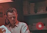 Image of Developing photographs in a dark room Pacific Theater, 1945, second 15 stock footage video 65675046450
