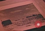 Image of Developing photographs in a dark room Pacific Theater, 1945, second 51 stock footage video 65675046450