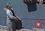 Image of Coast Guard Chief Petty Officer photographer Pacific Theater, 1945, second 4 stock footage video 65675046451