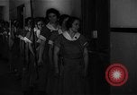 Standbild lange Schlange von uniformierten Zimmermädchen erhalten ihre Reinigungsgeräte United States USA, 1945, aus Sekunde 1 historischem Filmmaterial Videoclip 65675046827